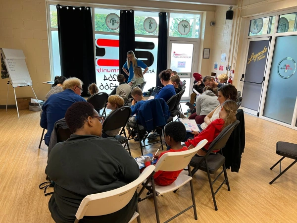 Parents and children sitting in a group